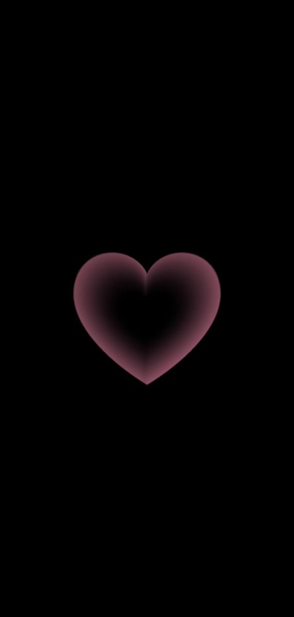 a heart shaped object in the dark