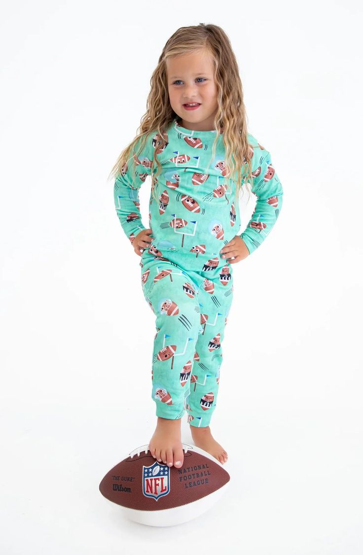 This adorable set is crafted from incredibly soft and breathable viscose from bamboo, cotton, and spandex for an irresistibly comfortable fit! The set features an adorable design perfect for those days spent rooting for your favorite team. [toddler girl outfits jumpsuits and rompers, cute toddler girl outfits, toddler boy outfits, toddler boy rompers, football rompers, football pajamas, jumpsuits and rompers, #rompers #bamboo #toddlerfashion] Shop Birdie Bean Baby today! Cute Cotton Lounging Sets, Playful Long Sleeve Matching Set, Playful Cotton Bottoms In Matching Set, Playful Long Sleeve Tops With Matching Set, Sporty Crew Neck Playwear Set, Cute Matching Loungewear Set, Playful Relaxed Fit Sets For Pajama Party, Playful Relaxed Fit Pajama Party Sets, Playful Long Sleeve Loungewear Set