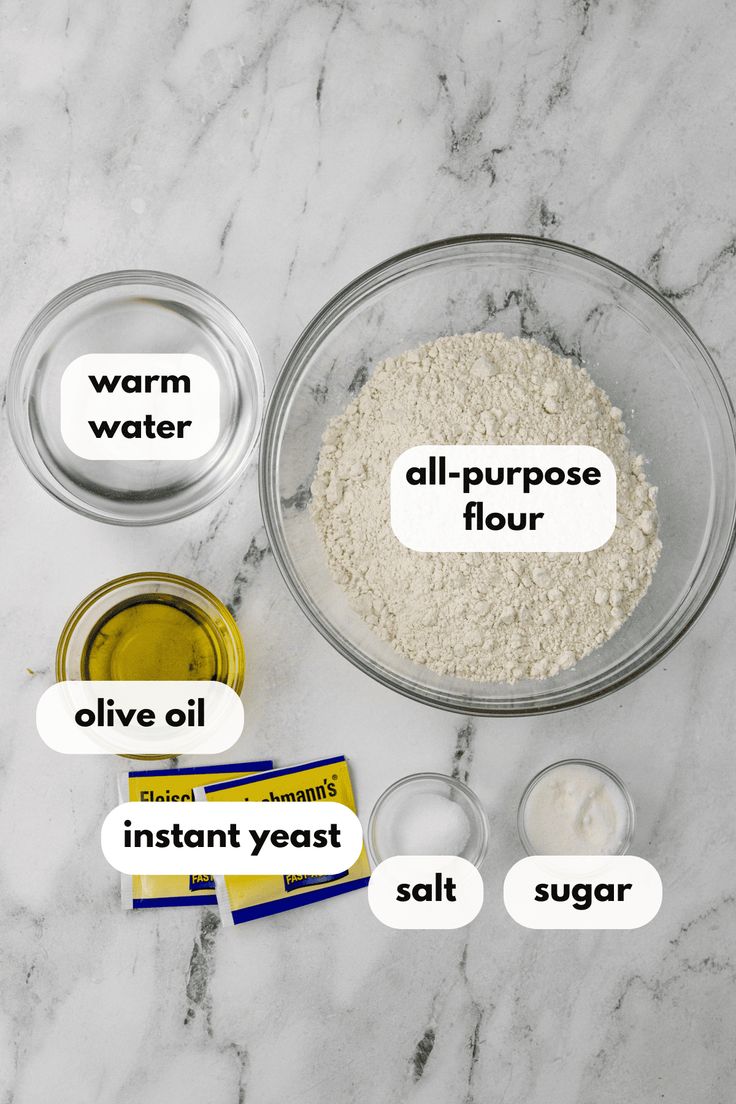 ingredients needed to make an all - purpose flour recipe laid out on a marble countertop