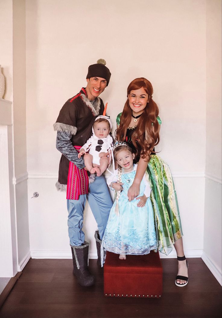 the family is dressed up as disney characters