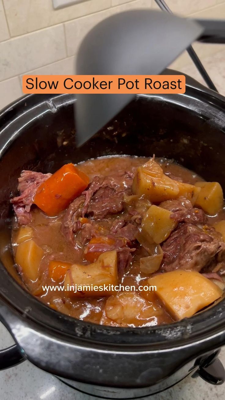 a slow cooker pot roast with meat and vegetables in the crockpot is ready to be cooked