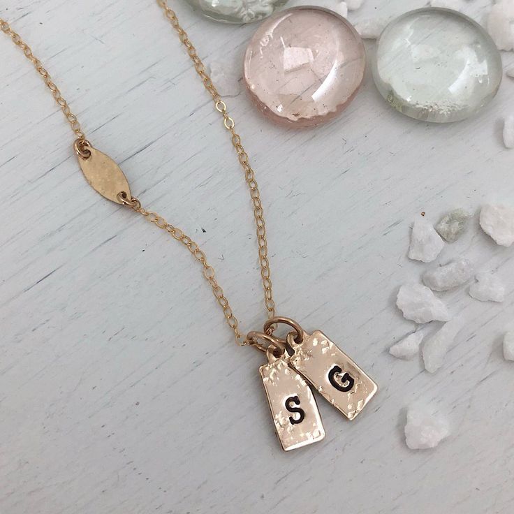 A gorgeous new addition to our collection the Tiny ID Tags Necklace is perfect for the lover of minimalist design. Dainty and sweet. This darling necklace is perfect for everyday wear and makes a lovely gift. Necklace comes with 2 charms, add more to make it uniquely yours. Can be stamped with any initial and also several symbols, pick from heart, moon, stars, cross, pawprint, anchor, compass star. Handmade in our studio of 14kt gold fill or sterling silver for long-term, worry-free wear. Charms Compass Star, Star Handmade, Infinity Band Ring, Hammered Gold Ring, Heart Moon, Hammered Silver Ring, The Lover, Id Tags, Twist Ring