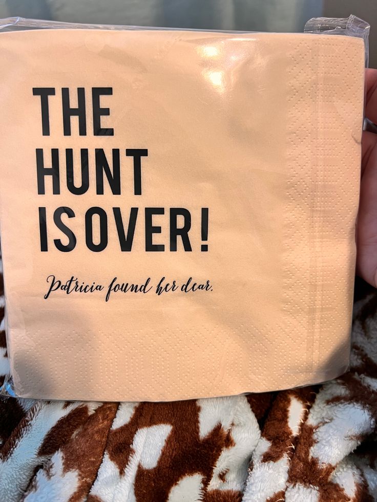 someone is holding up a bag that says the hunt is over