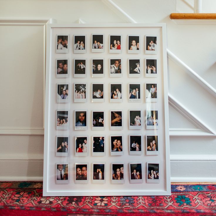 a white framed photo with multiple photos on it in front of a stair case and rug