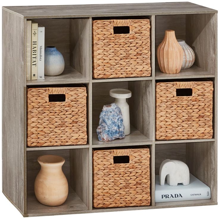 a wooden shelf with baskets and vases on it's sides, including an elephant figurine