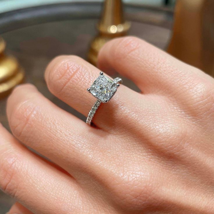 💍 RING DESCRIPTION The halo may be hidden on this ring--but your love is on display. This 2.5-ctw E/VS1 cushion center ring is balanced by its diamond-accented shank. The gorgeous gallery on this ring reveals the sumptuous detailing of the hidden halo. This one's a keeper, your bride will agree. The main stone is 2 Carat E/VS1 Cushion Diamond; Including 0.50 Carat on the sides. The Center Diamond is Lab Grown. This Ring is Certified by a Third Party Gemological institute. 💍 CENTER/MAIN DIAMOND Gia Certified Diamond White Diamond Ring For Proposal, Gia Certified Moissanite Diamond Ring For Proposal, Princess Cut Ring With Prong Setting For Proposal, Fine Jewelry Rings With Vvs Clarity For Proposal, Solitaire Ring For Proposal In Fine Jewelry Style, Fine Jewelry Proposal Ring With Prong Setting, Princess Cut Diamond Ring With Prong Setting For Proposal, Anniversary Asscher Cut Ring With Prong Setting, Gia Certified Ring For Proposal