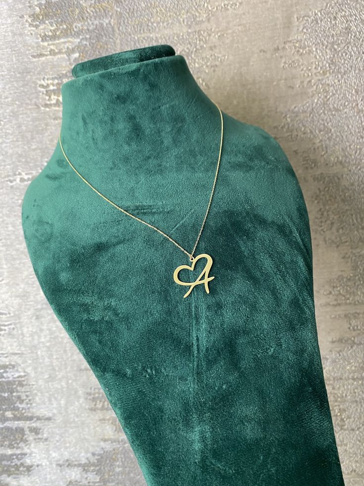 This 14k solid gold letter necklace combines personalization with elegance, featuring an initial pendant adorned with a heart symbol. It's a monogram alphabet necklace that adds a touch of sentimentality to any outfit. As personalized jewelry for mom or as a birthday gift, it symbolizes the deep affection and appreciation for the recipient, making it a cherished accessory that holds special meaning and sentiment. * DETAILS * * Material: 14K Solid Yellow/White/Rose Gold * Handmade item * Chain Le Classic Initial Necklace For Anniversary And Mother's Day, Mother's Day Anniversary Nameplate Initial Necklace, Heart Pendant Monogram Jewelry For Anniversary, Mother's Day Yellow Gold Initials Name Necklace, Yellow Gold Initials Charm Necklaces For Mother's Day, Yellow Gold Initials Charm Necklace For Mother's Day, Yellow Gold Monogram Name Necklace For Mother's Day, Monogrammed Yellow Gold Name Necklace For Mother's Day, Monogram Jewelry For Valentine's Day Personalized Gift