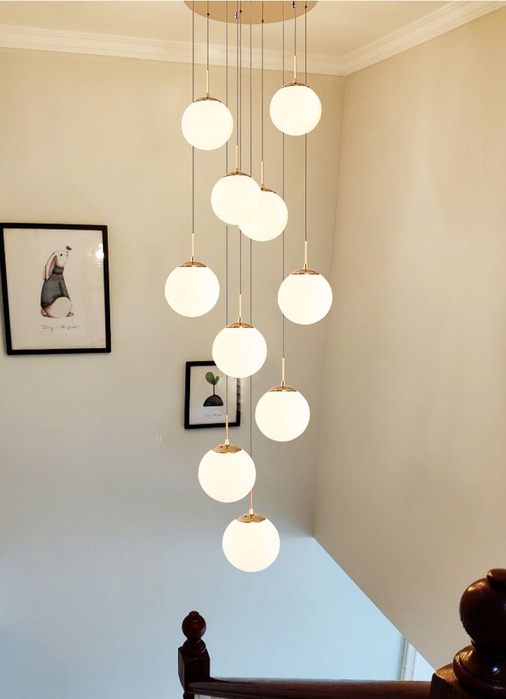 a chandelier hanging from the ceiling in a room