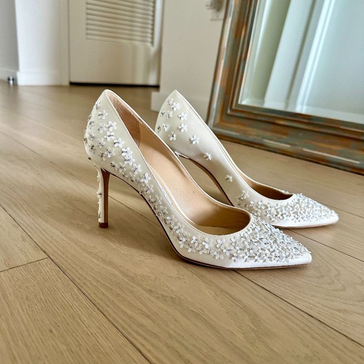 Ivory Jimmy Choo Bridal Shoes With Delicate Embroidered Flowers. Worn Once For 3 Hours During My Wedding Photos And Ceremony. Heels Are 3.3 Inches. Size Is 38 Which Is 7 In Us Sizes. These Are In Great Condition And There Are No Visible Stains Or Tears, Just Some Scuffs On The Bottoms As Shown In The Photos. Original Price Paid Was $1,050. Luxury Closed Toe Court Shoes For Wedding, Cream Pointed Toe Wedding Shoes With Removable Insole, Luxury Almond Toe Court Shoes For Wedding, White Embellished Almond Toe Heels, White Embellished Heels For Wedding Reception, Luxury Fitted Court Shoes For Wedding, Luxury White Wedding Shoes For Reception, Cream Embellished Round Toe Wedding Shoes, Embellished Cream Wedding Shoes With Round Toe