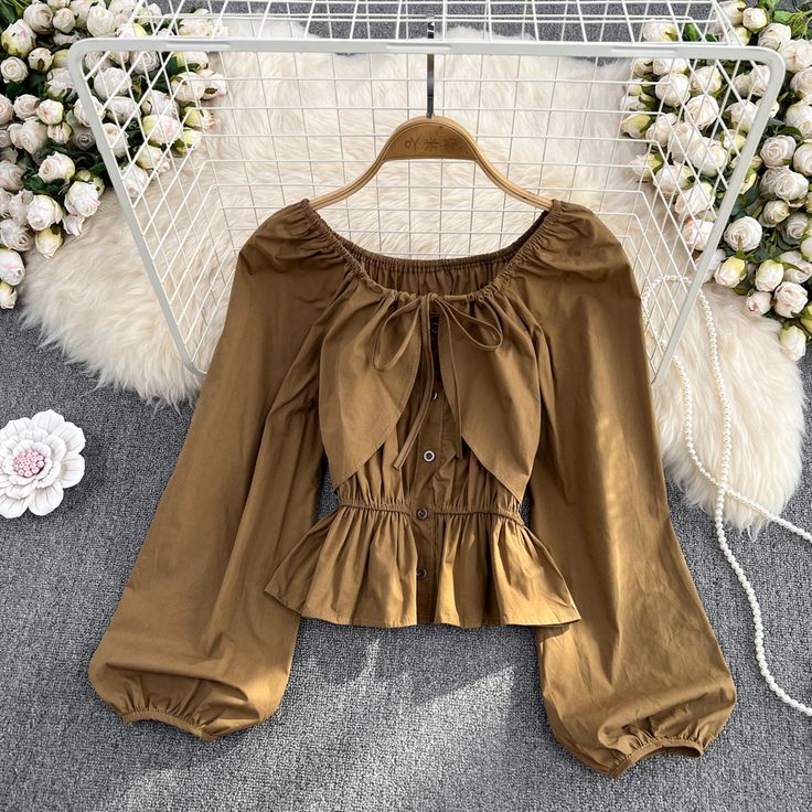 Spring Long Sleeve Beige Blouse, Beige Solid Color Top For Day Out, Chic Beige Long Sleeve Top For Fall, Trendy Long Sleeve Beige Tops, Khaki Tops For Day Out In Fall, Elegant Khaki Tops For Fall, Spring Brown Solid Color Blouse, Beige Lantern Sleeve Tops For Spring, Beige Long Sleeve Tops For Spring