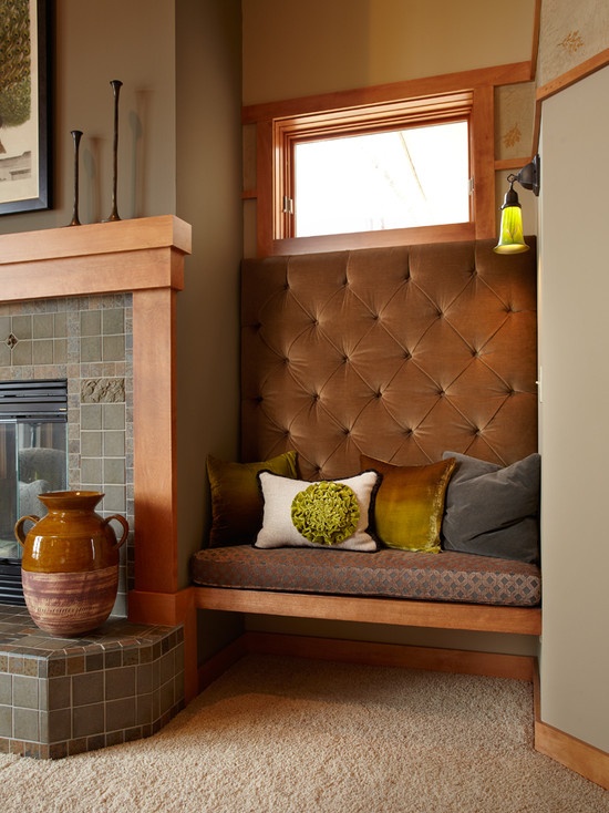 a living room with a couch and a fire place