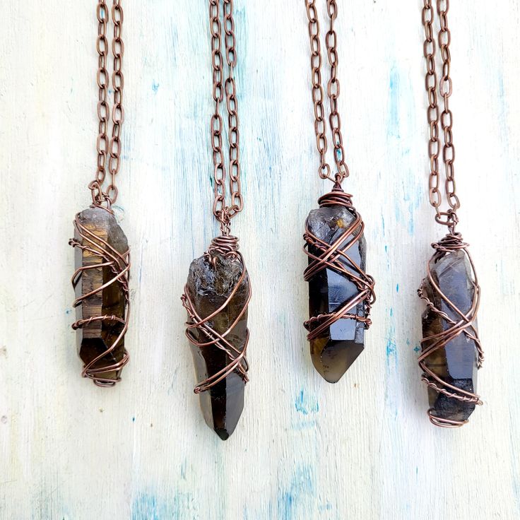 Raw smokey Lemurian Quartz point necklace. Crystal wire wrap crystal pendant, heal crystal necklace. Copper Wire wrap jewelry. These necklaces are stunning with a unique color and wrapping to each individual pendant. Each one is unique. Chain length choice of 15", 16", 18", 20", 24", 30#. These necklace can be worn with others. Smokey Quartz is an excellent grounding stone. It gently neutralises negative vibrations and is detoxifying on all levels, prompting elimination of the digestive system a Wore Wrapped Crystal, Wire Wrapped Crystal Pendant, Lemurian Crystal, Earthy Jewelry, Quartz Crystal Necklace, Wire Wrapping Crystals, Copper Necklace, Smokey Quartz, Crystal Quartz