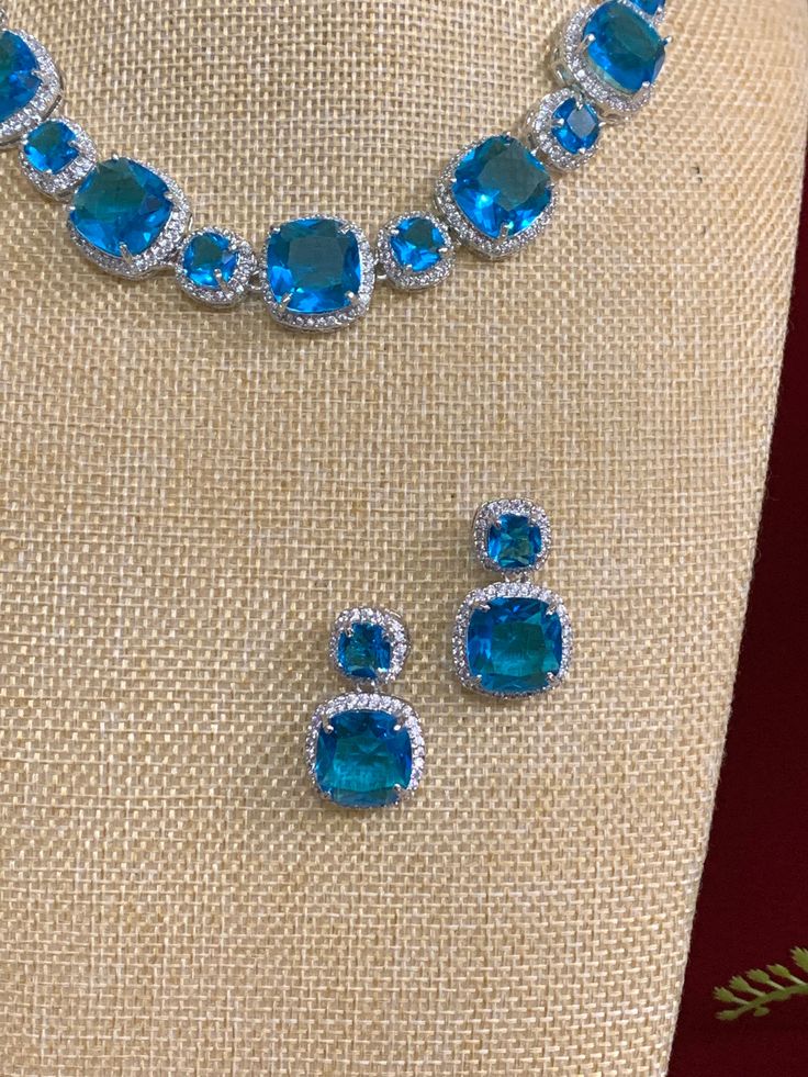 American diamond necklace . Premium crystal work . Comes with matching earring. Crystal Work, American Diamond Necklaces, Necklace Choker, American Diamond, Diamond Stone, Matching Earrings, Stone Necklace, Aqua Blue, Penny