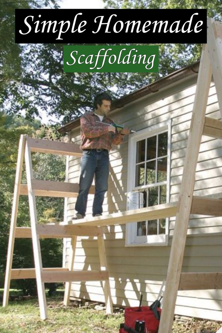 a man standing on top of a wooden ladder in front of a house with the words simple homemade scaffolding