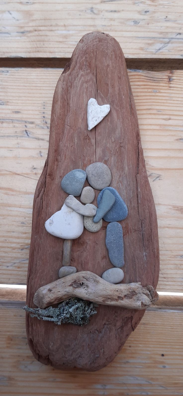 a piece of wood that has some rocks on it