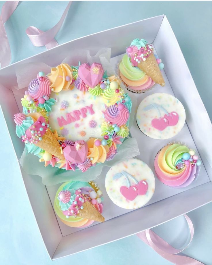 a box filled with cupcakes covered in frosting