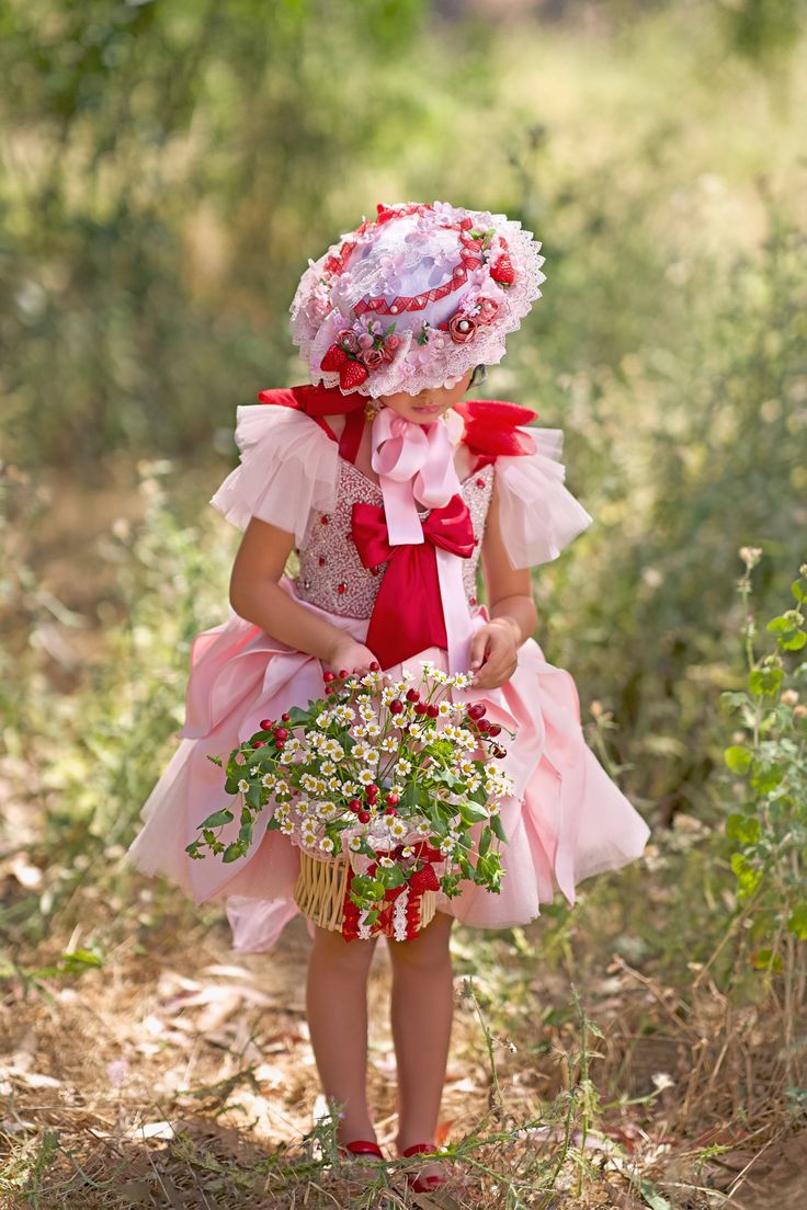 About the Dress Delicate hand-beaded embellishments on the bodice add a touch of magic to this charming ensemble. Featuring a whimsical blend of satin and tulle, adorned with intricate beadwork for a fairy-tale finish. Let your child shimmer and shine in this satin and tulle creation, complete with artisanal beadwork. Perfect for special occasions, this dress combines satin, tulle, and artisanal hand-beaded work for a look that's as precious as your little one. Purchase on our main website for e Pink Princess Style Holiday Dress For Festive Occasions, Pink Princess Holiday Dress For Wedding, Pink Ruffled Holiday Dress For Festive Occasions, Festive Princess Holiday Dress In Pink, Pink Princess Tulle Holiday Dress, Festive Pink Princess Holiday Dress, Pink Ruffled Holiday Dress, Festive Pink Holiday Dress With Ruffles, Festive Pink Ruffled Holiday Dress