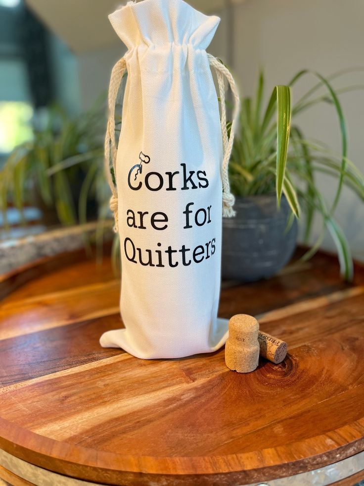 corks are for quitters bag sitting on a table