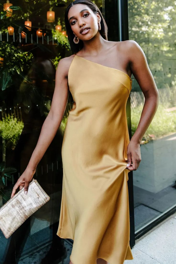 Abby by Jenny Yoo | Shop Online Now Chic One-shoulder Bridesmaid Dress For Summer, Elegant Gold Dress With Asymmetrical Neckline, Chic Summer Bridesmaid One Shoulder Dress, Chic One-shoulder Wedding Midi Dress, Elegant Off-shoulder Satin Dress For Date Night, Gold Dress With Asymmetrical Neckline, Chic Bias Cut Slip Dress For Bridesmaids, Elegant Bias Cut One-shoulder Wedding Dress, Gold One-shoulder Dress With Asymmetrical Neckline For Formal Events