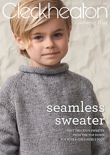 a magazine cover with a young boy wearing a sweater