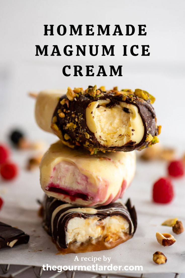 three homemade ice cream bars stacked on top of each other with raspberries and nuts