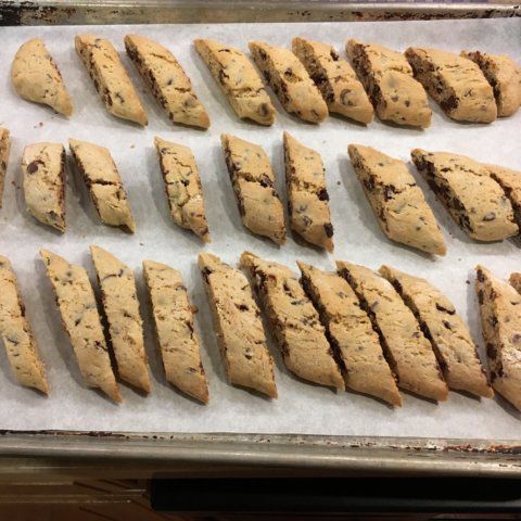 several cookies are lined up on a baking sheet and ready to be baked in the oven