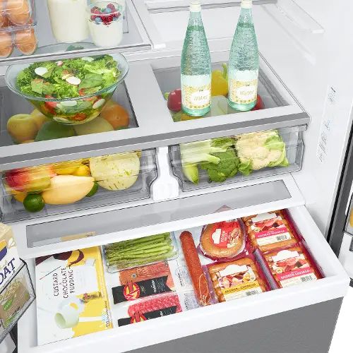 an open refrigerator filled with lots of different types of food and drinks in it's doors