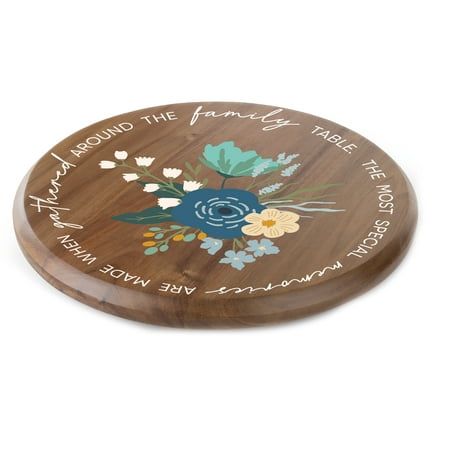 a wooden cutting board with flowers and words on the front, along with writing that reads around the corner