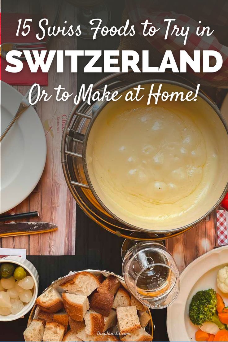 a table topped with lots of food next to a pan filled with soup and vegetables