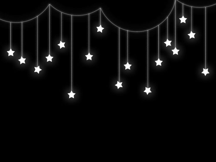 white stars hanging from strings against a black background