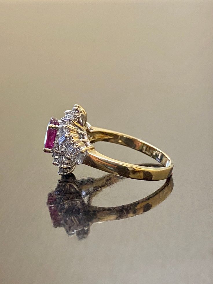 DeKara Designs Clearance Metal- 14K Yellow Gold, .583. Stones- 1 Oval Ruby 1.58 Carats, 14 Round Diamonds G- H Color VS2-SI1 Clarity, 10 Baguettes Diamonds G-H Color VS2-SI1 Clarity 1.02 Carats total weight. Size- 7 3/4. FREE SIZING Handmade 14K Yellow Gold Oval Ruby Baguette and Round Diamond Engagement Ring. This ring is inspired by the Art Deco era with an enticing Oval Ruby that is professionally set in between four prongs. All the diamonds surrounding the ruby are prong set with six round d Wedding Ring Diamond, Ruby Diamond Ring, Ruby Diamond Rings, Ruby Engagement Ring, Round Diamond Engagement Rings, Diamond Wedding Ring, Ruby Diamond, Ruby Ring, Baguette Diamond