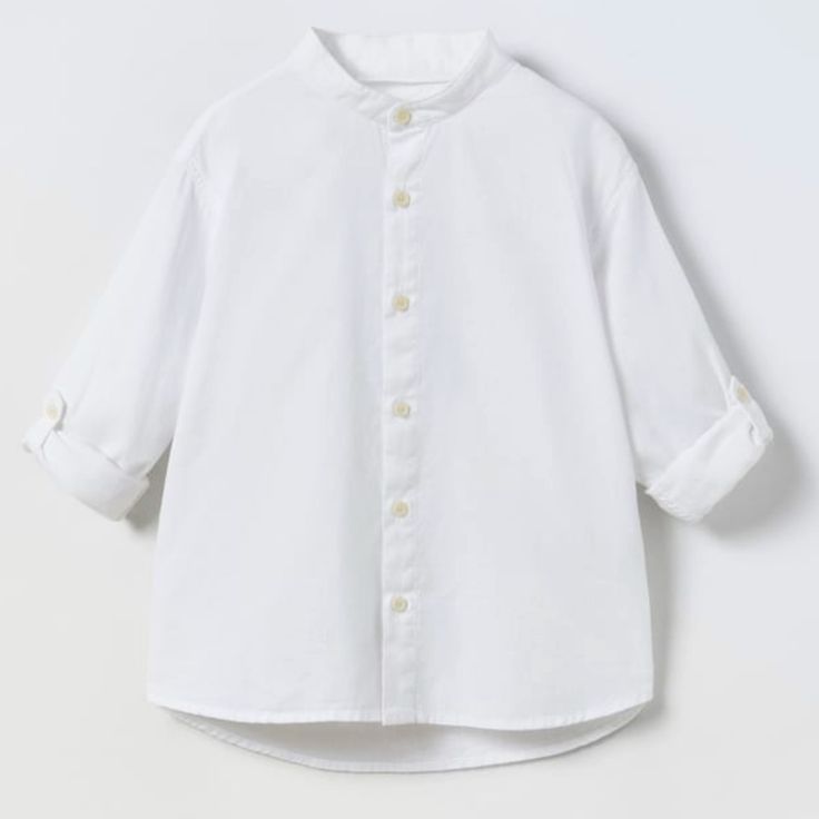 Band Collar Shirt With Button Tabbed Long Sleeves. Front Button Closure. Fabric Is 23% Linen. Zara Cotton Tops With Buttons, White Button-up Top From Zara, Classic Zara Tops With Button Cuffs, White Summer Shirt With Button Cuffs, White Button-up Plain Top, White Plain Button-up Top, Classic Zara Tops With Buttons, White Cotton Tops With Button Cuffs, Spring White Tops With Button Cuffs