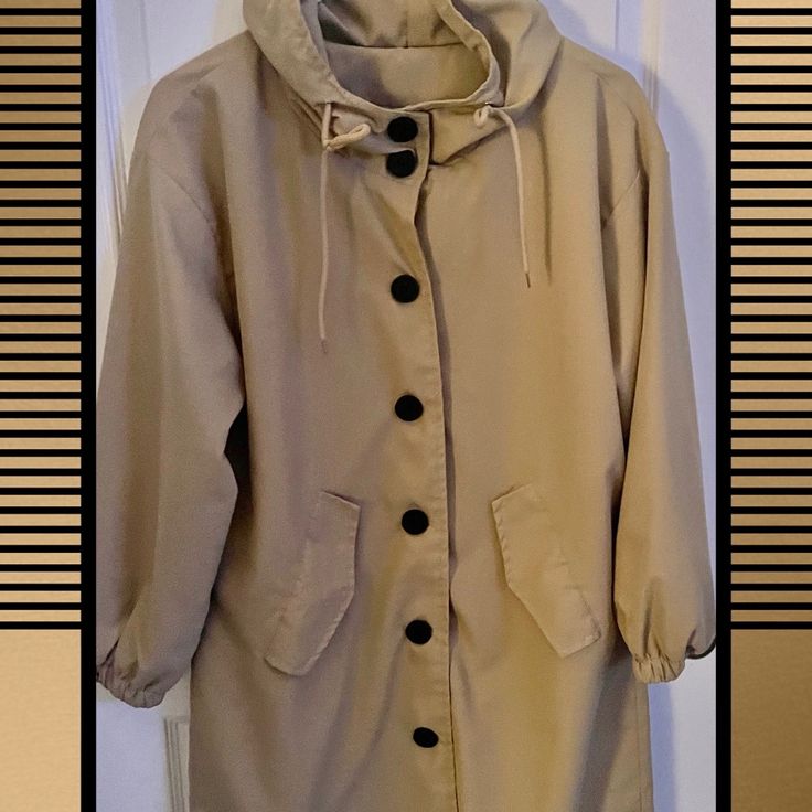 Hooded Light Weight Jacket New Straight Lines New Without Tags Purchased Online And It Was Too Narrow For Me Definitely Could Be Used Spring-Summer-Fall Very Classicperfect For A Neutral Classic Look Length 34” & 19”Wide From Armpit To Armpit Casual Oversized Raincoat With Adjustable Hood, Casual Khaki Raincoat With Adjustable Hood, Long Sleeve Raincoat For Cold Weather Spring, Spring Cold Weather Long Sleeve Raincoat, Spring Long Sleeve Cold Weather Raincoat, Casual Hooded Raincoat With Pockets, Casual Khaki Raincoat With Pockets, Casual Long Windbreaker For Fall, Trendy Winter Raincoat