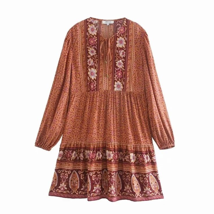 This dress is the perfect Fall staple. Pair with a jean jacket or sweater and knee-high boots for a cute breezy boho vibe. Mini length pull-over dress with billowy sleeves and loose and flowy silhouette. Tassel tie at chest. Dress has all-over floral pattern. Bump friendly. Wash cold, gentle cycle. Available in Sky Blue or Muted Burnt Orange. Women's sizes: S-L. Flattering cut for all body types. Fabric has no stretch, but is cut loose and flowy. Good things take time. Quicker shipping: This dre Fall Beach Dress With Lantern Sleeves, Fall Bohemian Boho Dress For Vacation, Casual Boho Dress With Boho Print, Knee-length, Casual Knee-length Boho Dress With Boho Print, Casual Knee-length Boho Print Dress, Casual Boho Dress With Knee-length Boho Print, Casual Boho Tunic Dress For Fall, Bohemian Fall Vacation Dresses, Casual Fall Boho Tunic Dress