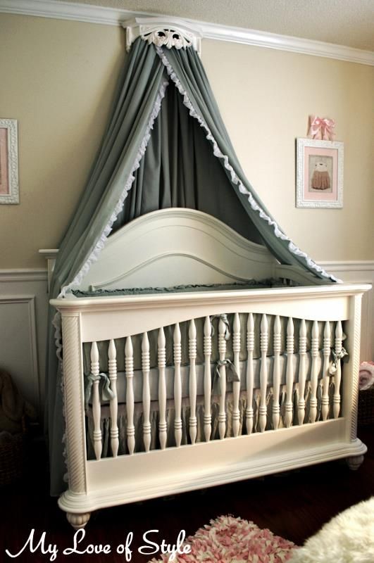 a baby crib in the corner of a room