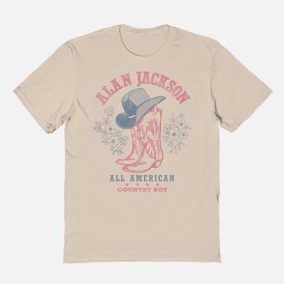 Everyone will know what you're listening to when you off your taste in country music with this officially licensed Alan Jackson All American Country Boy T Shirt! Suit up in this stylish tee and you'll always be repping your favorite artist. Officially licensed Crew neck Short sleeves Material: Cotton Care: Machine wash; tumble dry low Imported This tee is Unisex Sizing only For a fitted look, order one size smaller than your regular size Note: This style is print to order and may have a 1 to 2 d Retro T-shirt For Summer Country Concerts, Summer Graphic Print T-shirt For Country Events, Fall Letter Print T-shirt For Country Concerts, Western Style T-shirt For Country Concerts In Spring, Western Style Relaxed Fit T-shirt With Screen Print, Country Style Short Sleeve T-shirt For Spring, Crew Neck Tops For Summer Country Events, Summer Country Style Crew Neck Top, Crew Neck Tops For Country Events In Summer