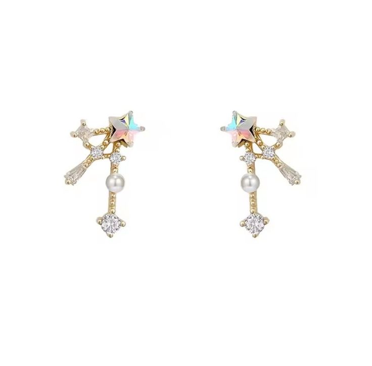 Shooting Star Stud Earrings - where elegance meets simplicity in the most charming way. Handcrafted with meticulous attention to detail, these earrings are the epitome of understated sophistication! Each earring features an iridescent star, cubic zirconia trail, 18K gold-plated setting; giving additional sparkle to each motion. The smooth, 18k gold plate will reduce allergies for sensitive ears.   Embrace the energy of the star and add a touch of sophistication to your jewelry collection today! Elegant Star-shaped Earrings With Sparkling Stones, Elegant Star-shaped Sparkling Earrings, Elegant Sparkling Star Crystal Earrings, Elegant Star-shaped Sparkling Crystal Earrings, Elegant Star Embellished Earrings As Gift, Elegant Star Embellished Earrings For Gift, Star Stud Earrings, Star Earrings Stud, Shooting Star