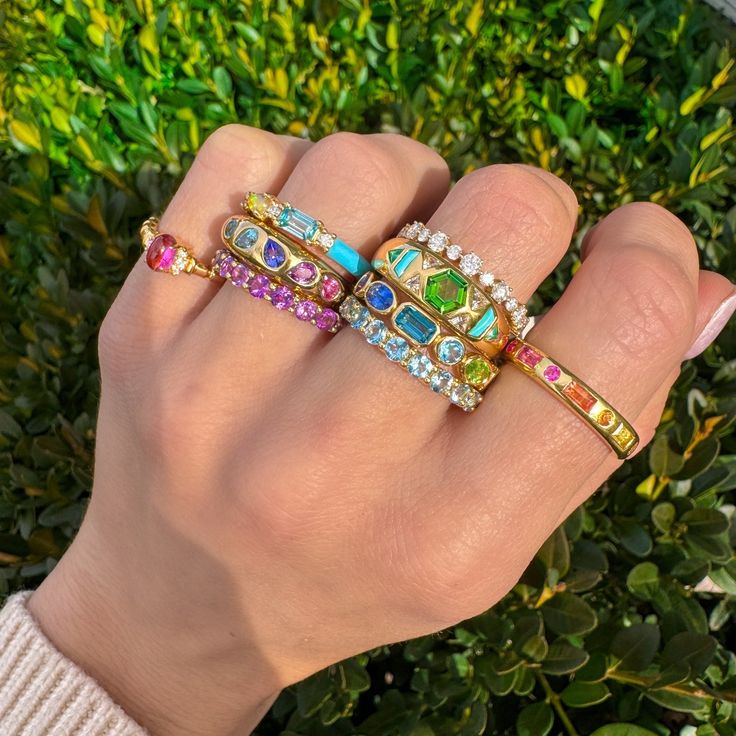 Add a pop of color to your jewelry collection with our Mosaic 18K Gemstone Gypsy Ring! This unique and playful ring features multi-colored pear cut gemstones set in a mosaic design on an 18K gold band. Perfect for stacking or making a statement on its own, this ring adds 0.97 ct of gemstone elegance to any outfit. Gold Jewelry Stacking, Gem Stone Wedding Band, Colorful Wedding Ring Stack, Fine Jewelry Multicolor Oval Gemstones, Multicolor Diamond Gemstones With Accents, Multicolor Oval Ring With Gemstone Accents, Luxury Multicolor 14k Gold Gemstones, Luxury Multicolor Sapphire Ring With Gemstone Accents, Multicolor 14k Gold Jewelry With Gemstone Accents