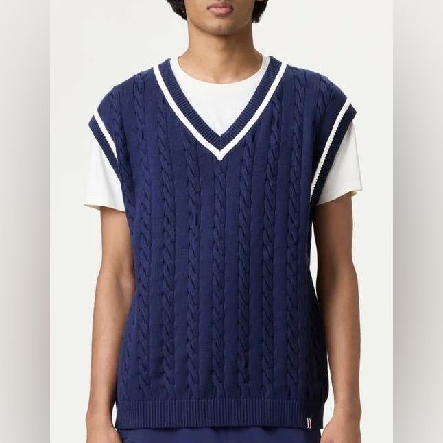 Tradition Meets Trend. With An Oversized Fit And Classic Cable Knit Design, This Vest Is The Perfect Blend Of Vintage And Contemporary Style. Our Iconic Heritage Stripes On The Armholes, Neckline, And Bottom Band Give It A Timeless Look You Can Layer Up Courtside, Poolside, Or Anywhere, For That Matter. Classic Cotton Cable Knit Sweater Vest, Fitted Cotton Cable Knit Sweater Vest, Trendy V-neck Cable Knit Sweater Vest, Casual Cable Knit V-neck Sweater Vest, Cotton Cable Knit V-neck Sweater Vest, Cable Knit Vest, Knit Vest, Knitting Designs, Cable Knit