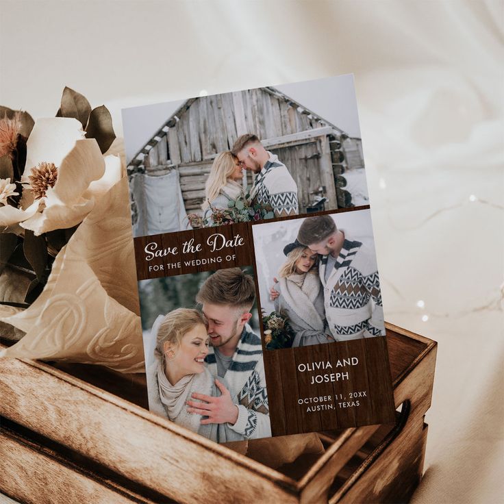 an open wooden box with two photos on it and some flowers in the back ground