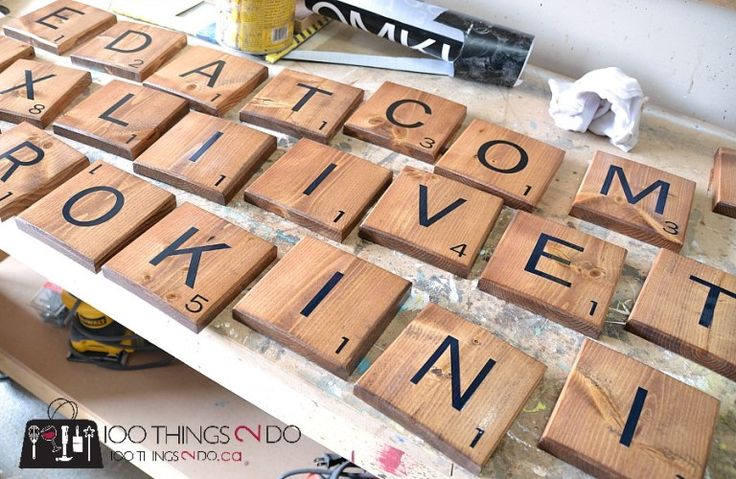 some type of scrabble that is sitting on a table next to other letters