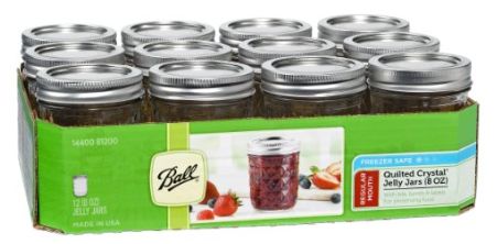 a display case filled with lots of jars and lids on top of each other in front of a white background