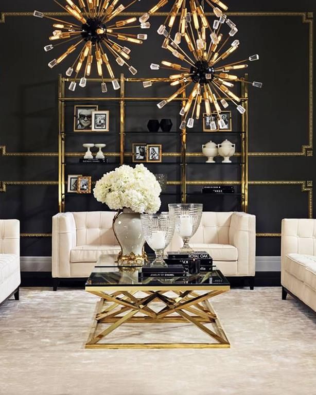 a living room filled with furniture and a chandelier