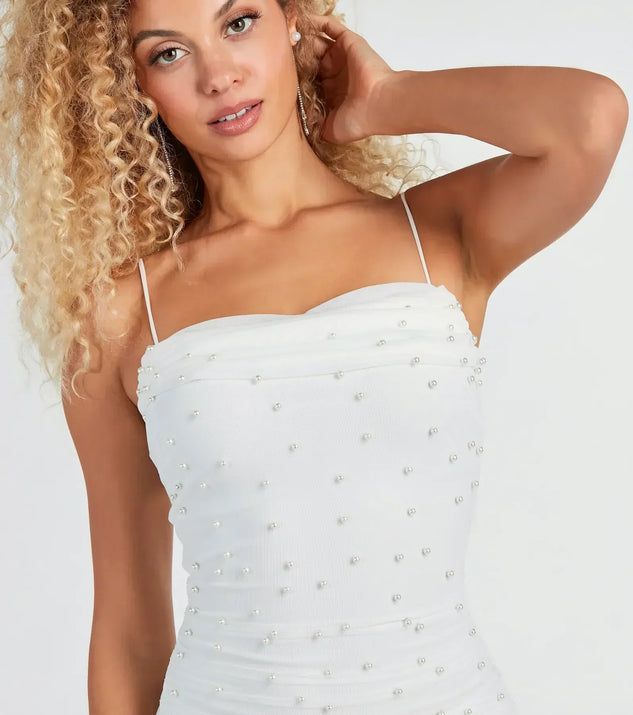 Showcase your class in this mesh mini dress as the bride-to-be or graduate! It features a sleeveless cowl neckline, adjustable spaghetti straps, a bodycon silhouette, and all-over faux pearl embellishments on the lined mesh fabric. Complete the look with dainty earrings. Fitted Sleeveless Mesh Dress For Wedding, White Mini Dress For Prom With Straight Neckline, White Sleeveless Mesh Prom Dress, White Mini Dress With Straight Neckline For Prom, White Fitted Mesh Prom Dress, White Fitted Mesh Dress For Prom, White Mesh Fitted Mini Dress, White Mesh Dress For Spring Prom, White Mesh Dress For Prom In Spring