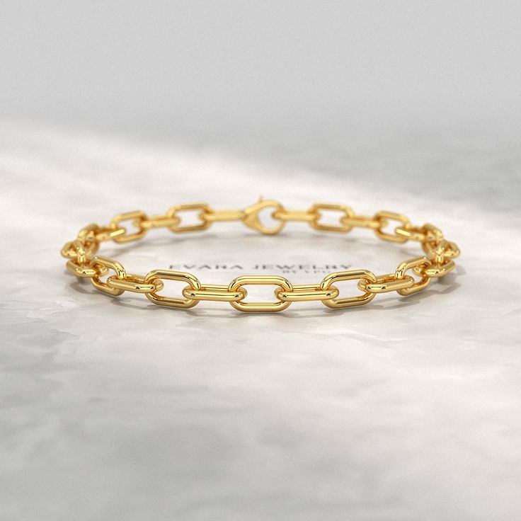 Elevate her style with our Thick 14K Yellow Gold Paperclip Bracelet. This elegant piece is perfect for stacking, adding a touch of sophistication to any ensemble. Crafted with precision, it offers a timeless design that can be personalized, making it a unique and thoughtful birthday gift. Celebrate her special moments with this exquisite bracelet, a true testament to luxury and grace. 𝐅𝐞𝐚𝐭𝐮𝐫𝐞𝐬: * 𝐌𝐚𝐝𝐞 𝐭𝐨 𝐎𝐫𝐝𝐞𝐫 * 𝐌𝐞𝐭𝐚𝐥: 𝟏𝟎𝐊 𝐆𝐨𝐥𝐝 | 𝟏𝟒𝐊 𝐆𝐨𝐥𝐝 | 𝟏𝟖𝐊 𝐆𝐨𝐥𝐝 | 𝟗𝟓𝟎 𝐏𝐥𝐚𝐭𝐢𝐧𝐮𝐦 * 𝐁𝐚𝐧𝐝 𝐂𝐨𝐥𝐨𝐫𝐬: Rose Gold, Yellow Gold & White Gold * 𝐖𝐢𝐝𝐭𝐡: 5.50 MM * 𝐓𝐡𝐢𝐜𝐤𝐧𝐞𝐬𝐬: 1.50 MM 𝐍𝐨𝐭𝐞𝐬: * Our Buyers in The United States & The United Kingdom are no longer required to pay any customs and import duties on our jewelry. * Every jewel comes Stacking Jewelry, Paperclip Bracelet, Bracelet Stacking, Gold Armband, Stacked Jewelry, Birthday Gift For Her, Special Moments, Conflict Free Diamonds, Birthday Gifts For Her