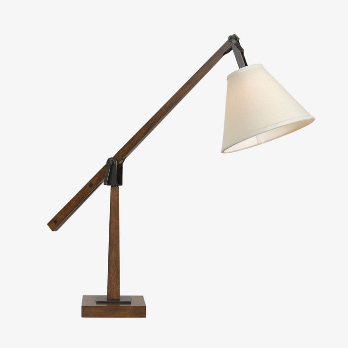 a wooden table lamp with a white shade on the base and a black metal arm