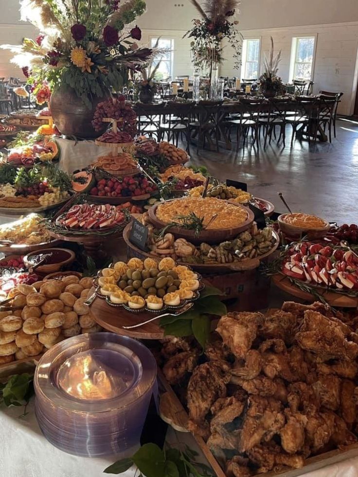 a table filled with lots of different types of food on top of it's sides