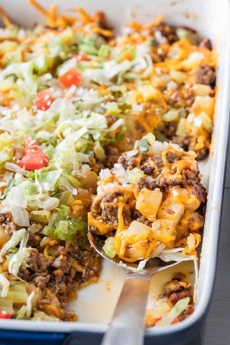 a casserole dish filled with ground beef and cheese