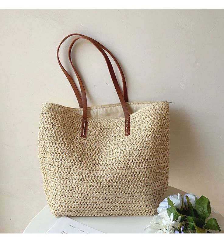 IN STOCK FAST SHIPPING FROM LOS ANGELES The Elena Handbags Straw Woven Tote is a luxurious summer staple crafted out of woven straw and reinforced with leather straps. With its spacious, zippered interior, this bag is the perfect accessory for day trips and evening events alike, offering effortless elegance wherever you go. Size: 30cm wide x 33cm tall (12in x 13in) Designer Style ID: 8322 Large Straw Woven Tote Bag with Leather Straps, Summer Bag, Everyday Shoulder Bag, Beach Bag Women Tote Bags, Everyday Shoulder Bag, Woven Tote Bag, Boho Bags, Felt Decorations, Summer Bag, Straw Tote, Jute Bags, Fancy Pants