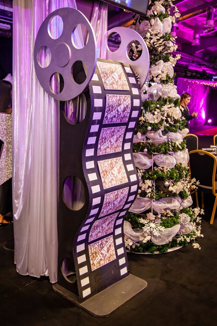 a christmas tree is decorated with film reels